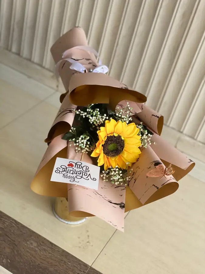 Sunflower bouquet in kraft paper with a birthday tag